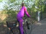 Watch Sandra riding her Bike in her sexy pink shiny nylon Rainsuit 8
