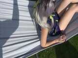 Watch Chloe enjoying her shiny nylon Downwear outside at a sunny Day 7