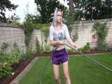 Get a video with Chloe enjoying gardening in her shiny nylon Shorts 10