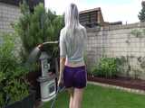 Get a video with Chloe enjoying gardening in her shiny nylon Shorts 5
