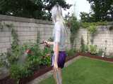 Get a video with Chloe enjoying gardening in her shiny nylon Shorts 9