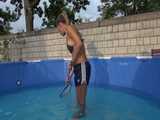 Get a Video with Sandra cleaning the Pool in her shiny nylon Shorts 8